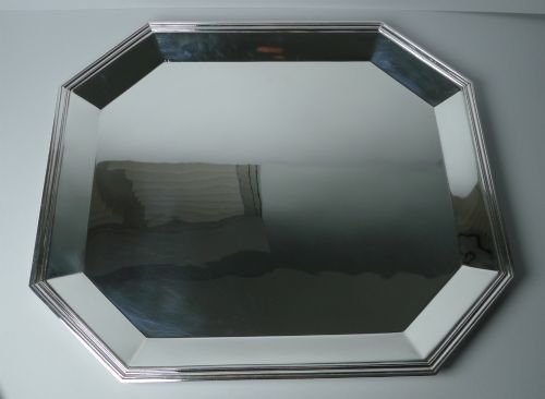 fig 4. An octagonal silver-plated Art Deco tray featuring a polished reflective surface and a stepped moulded border.