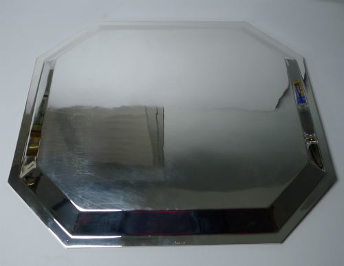 fig 5. An octagonal silver-plated Art Deco tray featuring a polished reflective surface and a stepped moulded border.