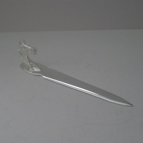 fig 1. A silvered bronze letter opener featuring a detailed sculpted horse head handle and a polished, tapered blade resting on a neutral background.