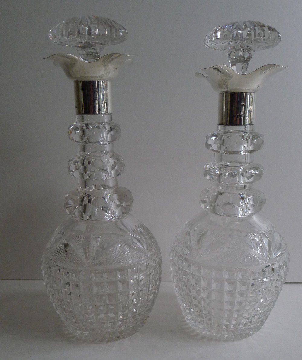 Pair Finest Quality Cut Crystal and English Sterling Silver Decanters