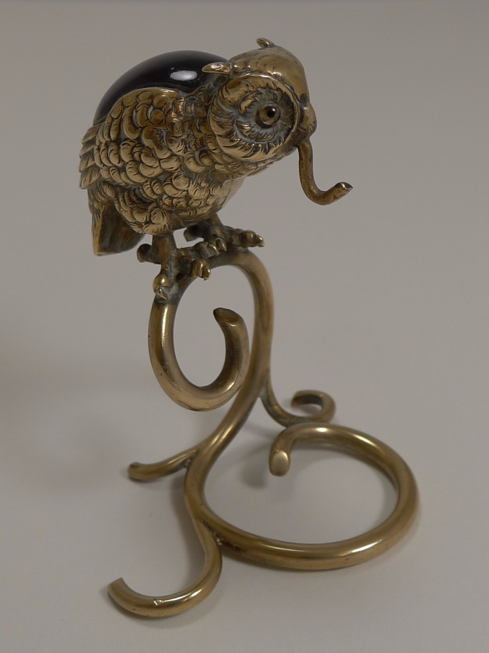 Antique English Brass Figural Pocket Watch Stand - Glass Eyes and Amethyst Coloured Inset