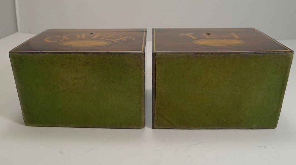 A pair of dark wood Victorian tea and coffee caddies featuring scroll marquetry on the lids and inlaid lettering on the front. View VII