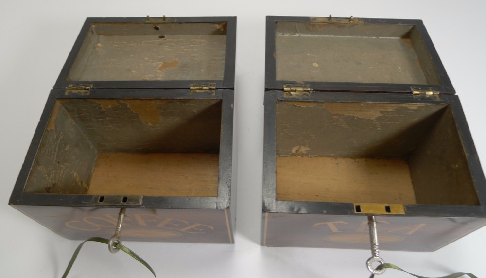 A pair of dark wood Victorian tea and coffee caddies featuring scroll marquetry on the lids and inlaid lettering on the front. View VIII