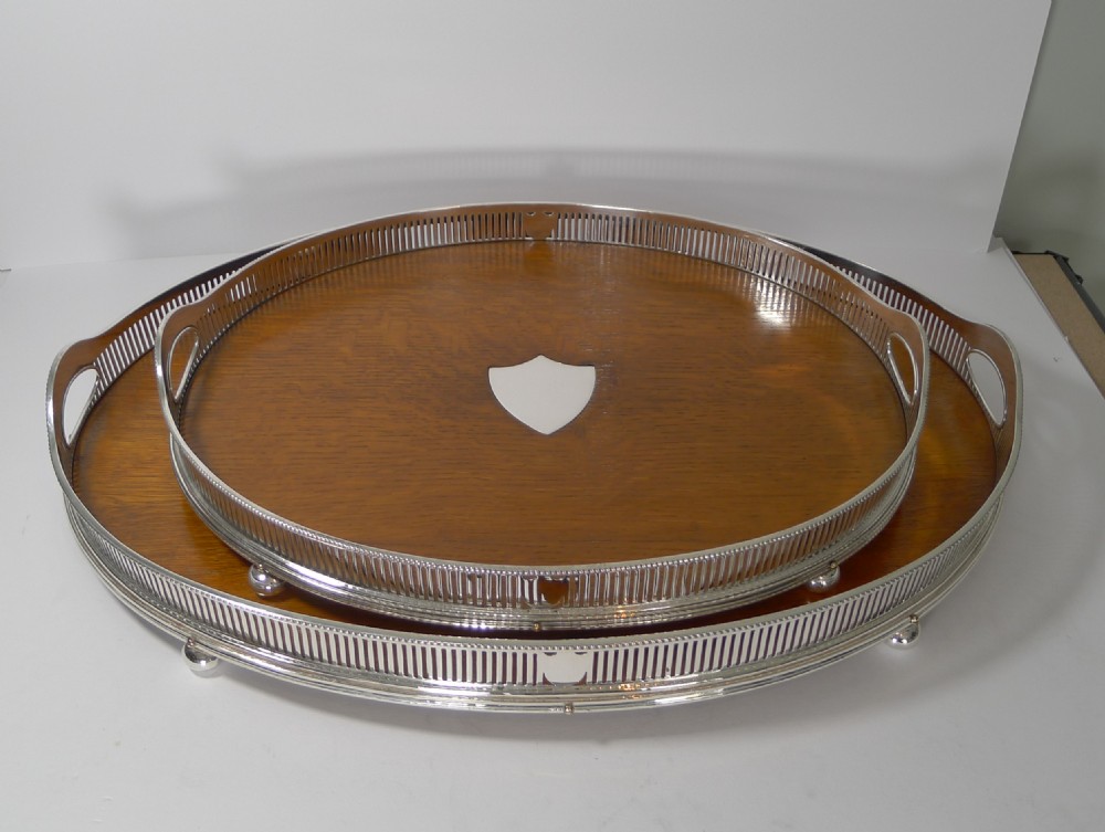 Grand Graduated Pair Late Victorian Oak and Silver Plate Serving Trays View X
