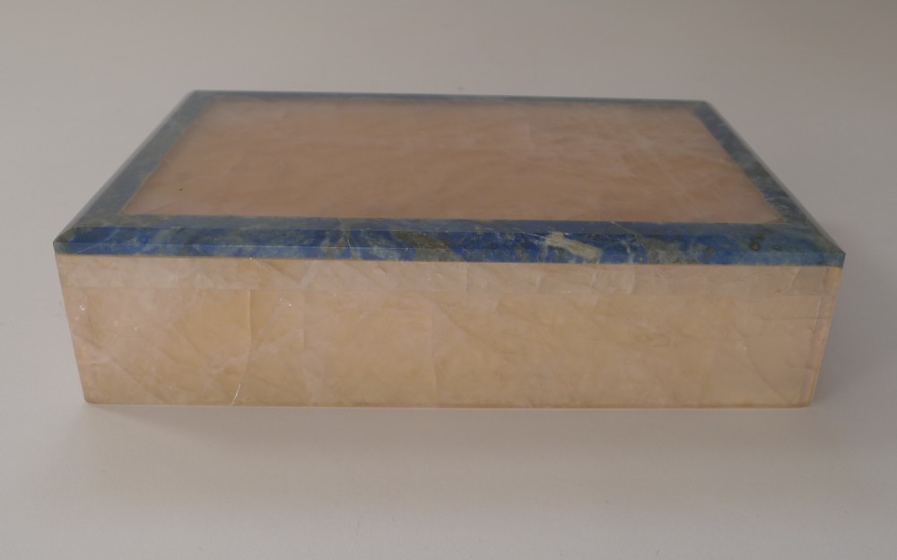 A rectangular rose quartz box featuring a flat lid accented with a deep blue lapis lazuli border. View VI