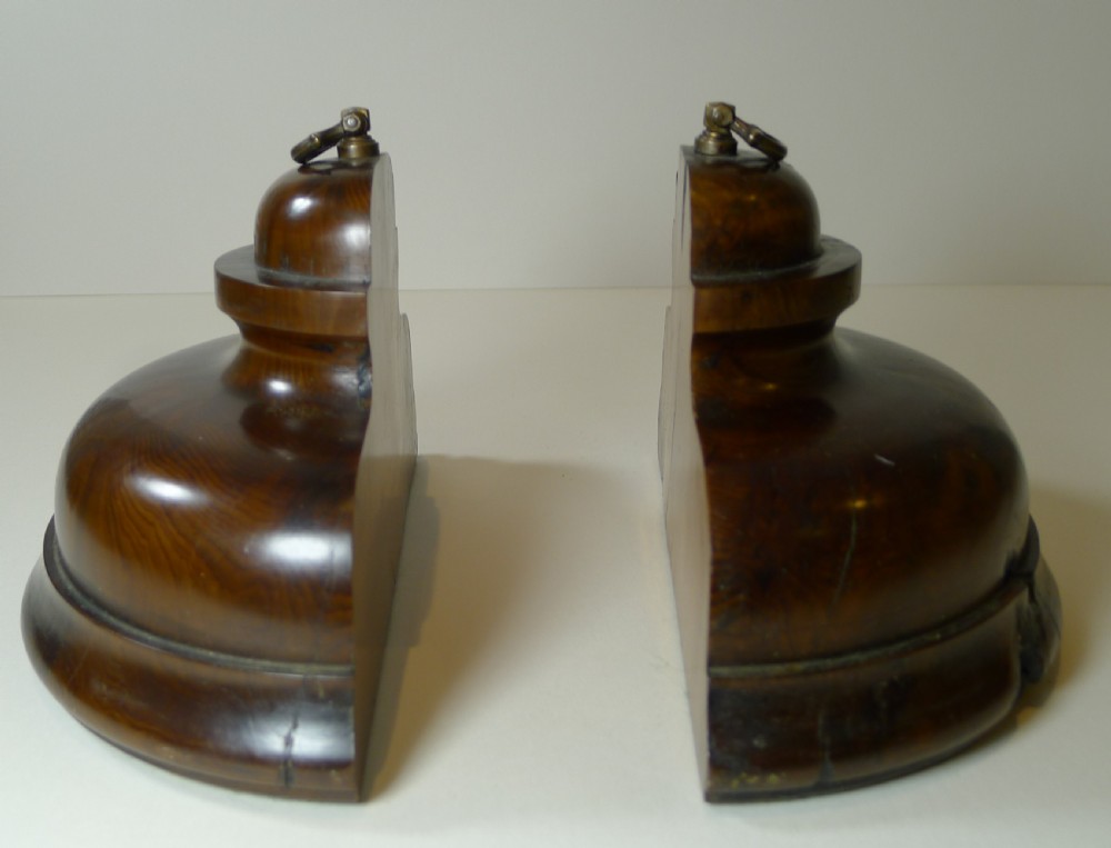 A pair of turned dark yew wood bookends featuring stepped moulded bases, domed tops, and brass ring handles. View XIII