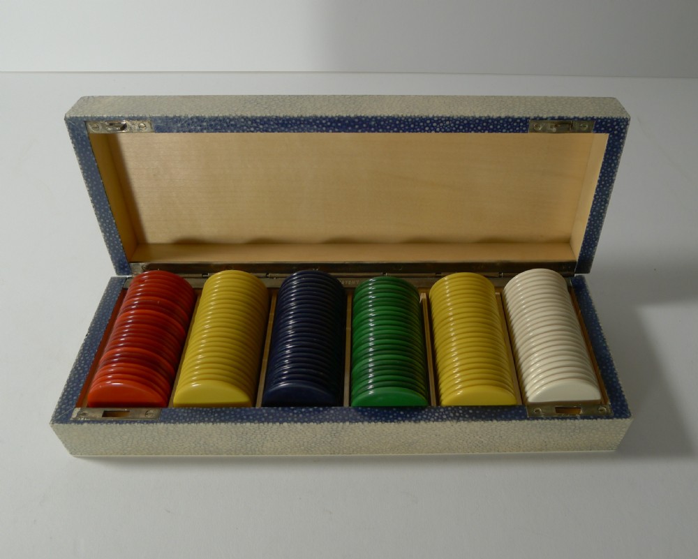 A rectangular Art Deco cream shagreen box positioned behind multiple stacks of colourful circular gaming counters. View III