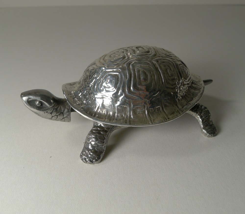 An Edwardian sterling silver novelty desk bell cast in the detailed shape of a tortoise with hallmarked shell. View III