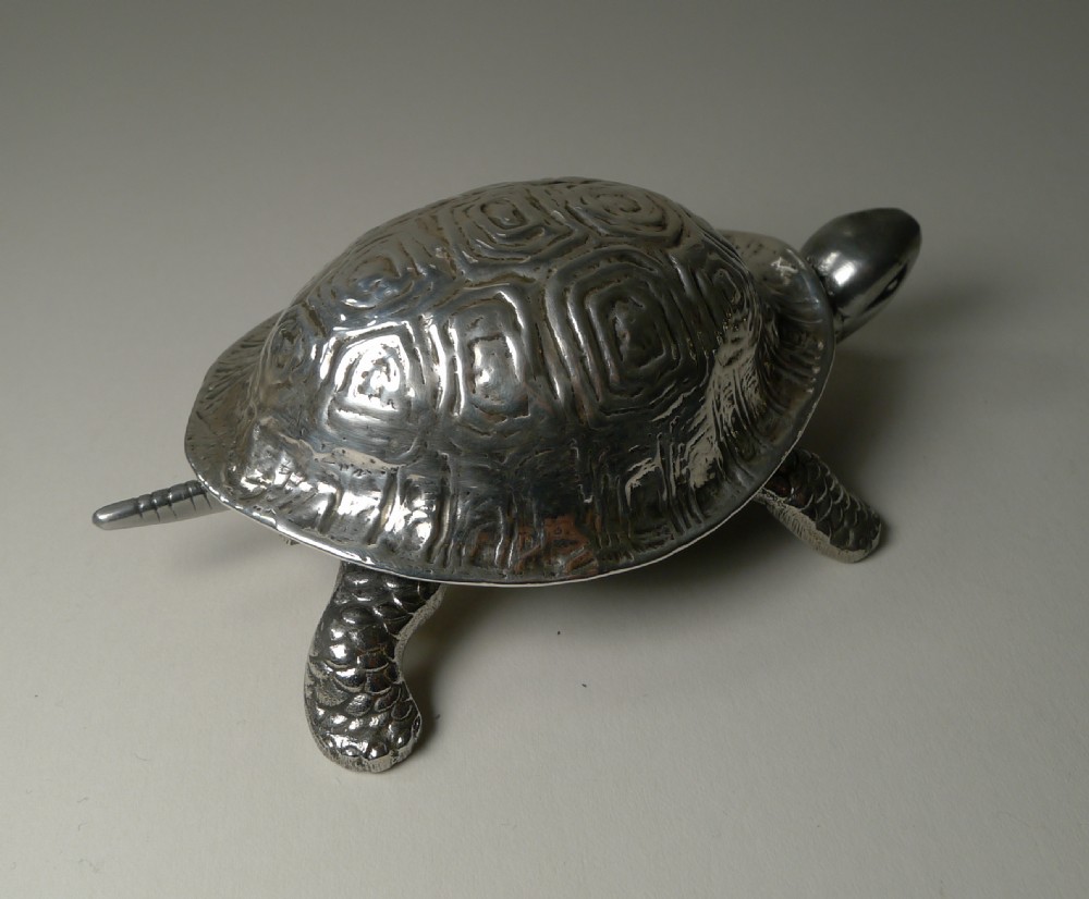 An Edwardian sterling silver novelty desk bell cast in the detailed shape of a tortoise with hallmarked shell. View V