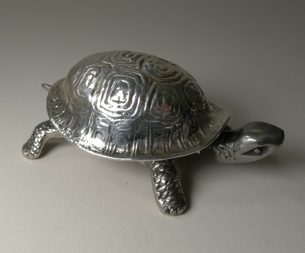 An Edwardian sterling silver novelty desk bell cast in the detailed shape of a tortoise with hallmarked shell. View VI
