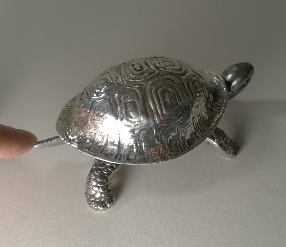 An Edwardian sterling silver novelty desk bell cast in the detailed shape of a tortoise with hallmarked shell. View VII