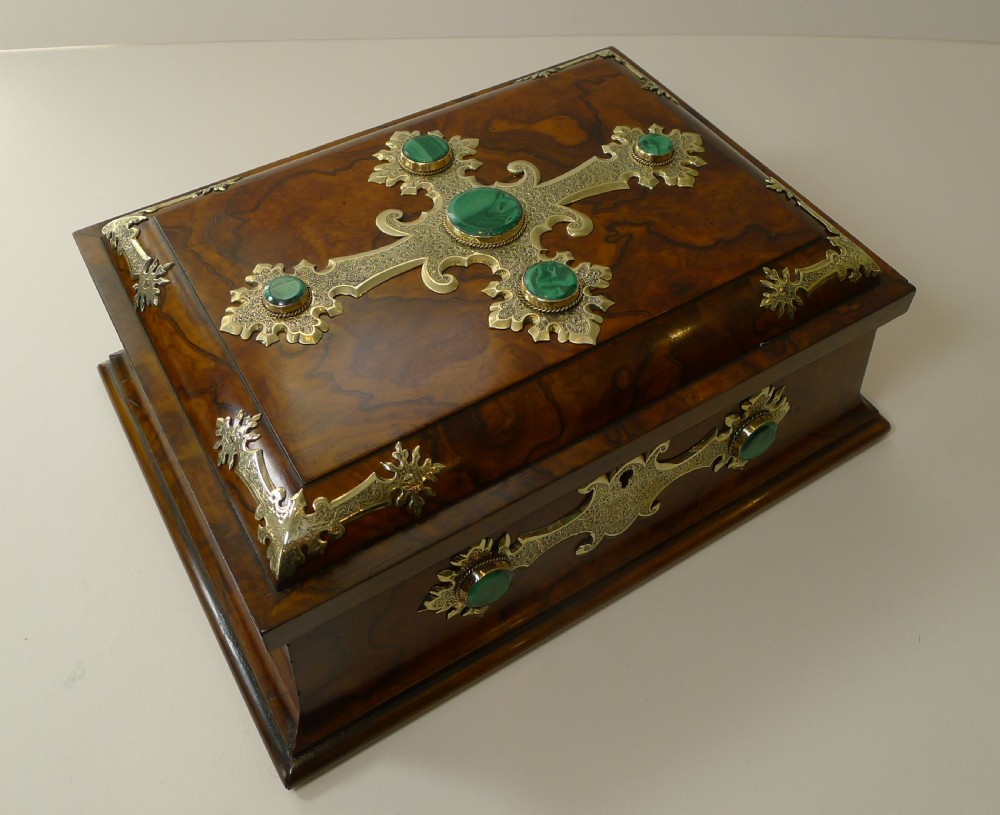 A rectangular burr walnut box decorated with engraved brass strapwork and inset green malachite cabochons. View II