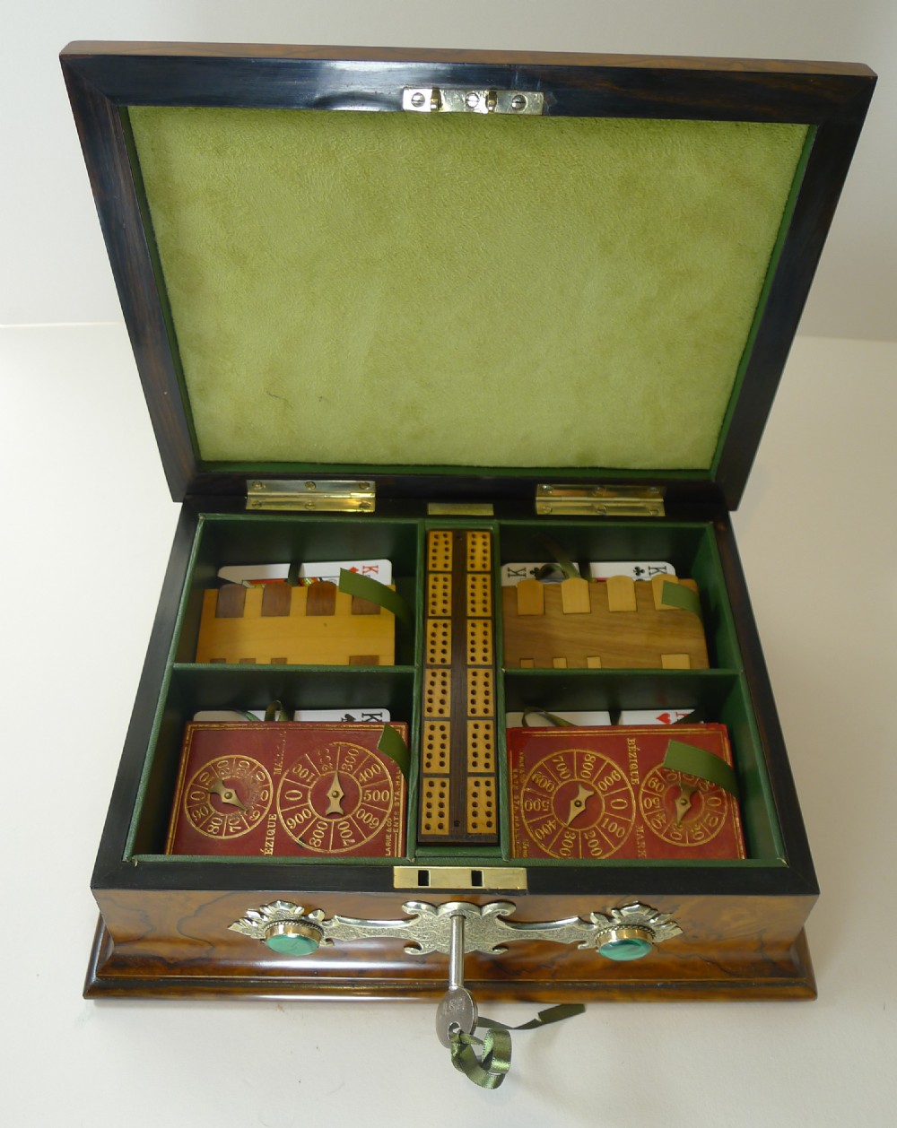 A rectangular burr walnut box decorated with engraved brass strapwork and inset green malachite cabochons. View V