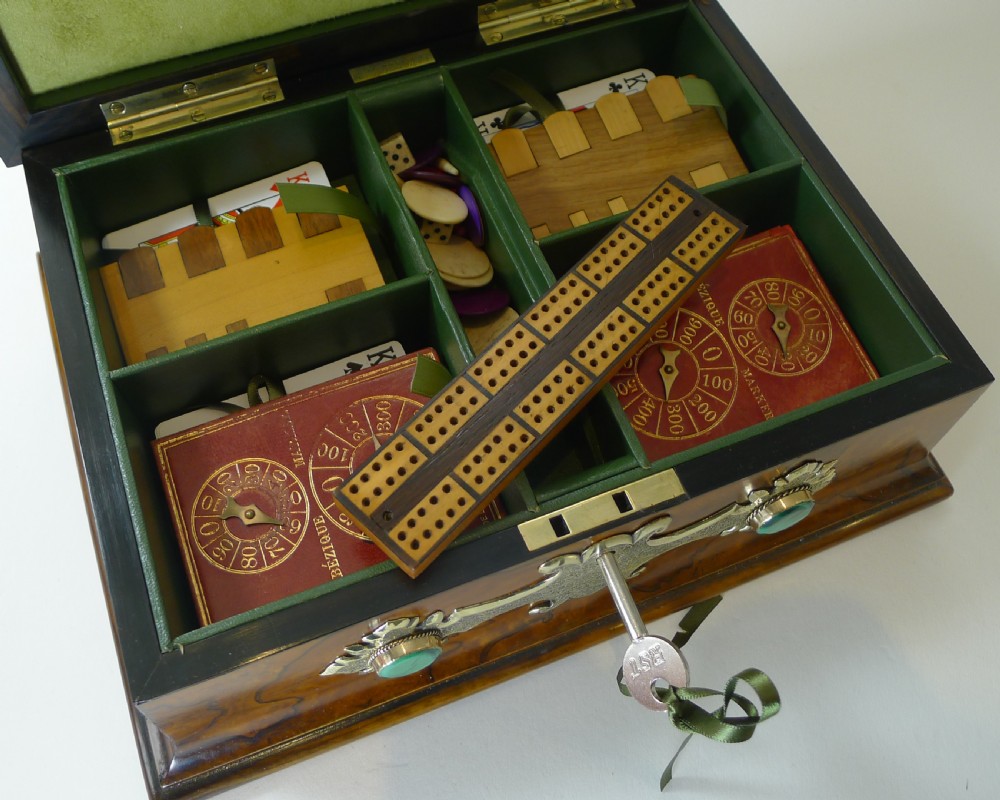 A rectangular burr walnut box decorated with engraved brass strapwork and inset green malachite cabochons. View VII