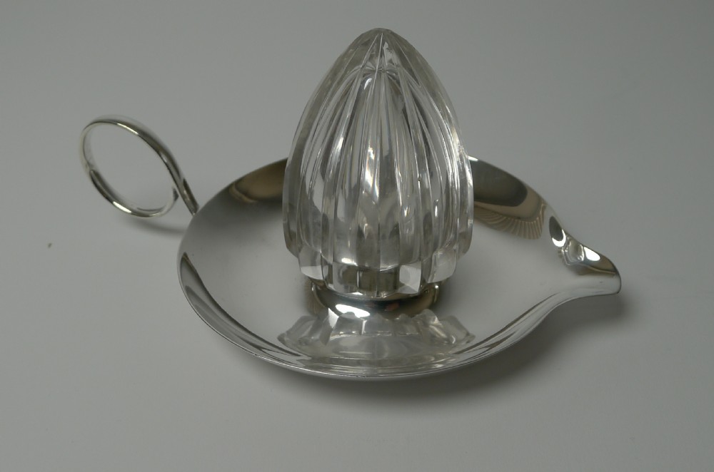 An Edwardian silver plated tray featuring a single loop handle, pouring spout, and a central faceted cut crystal lemon squeezer cone. View VI