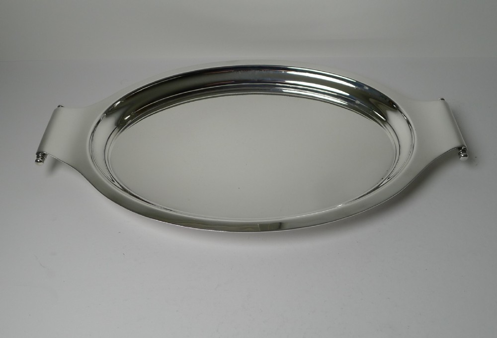 A polished silver-plated oval Art Deco cocktail tray featuring integrated curved handles with spherical accents. View V