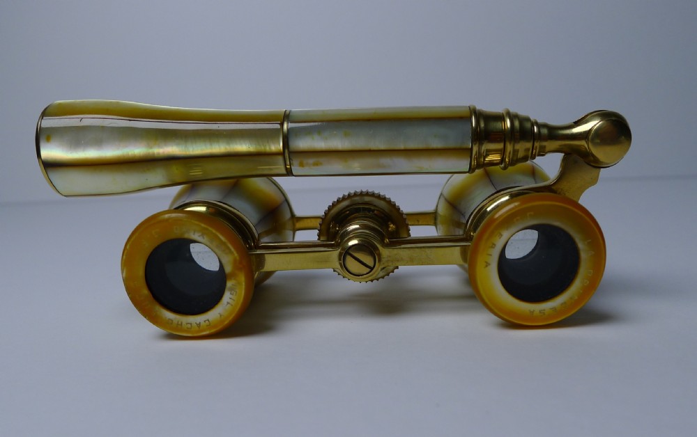 A pair of brass French opera glasses featuring iridescent mother of pearl panels and an extendable side handle. View VIII