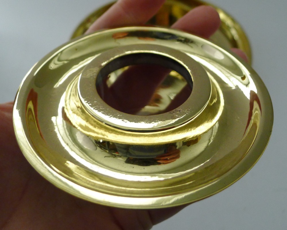 A Victorian novelty inkwell featuring a silvered owl head with yellow glass eyes resting on a circular polished brass dish base. View III