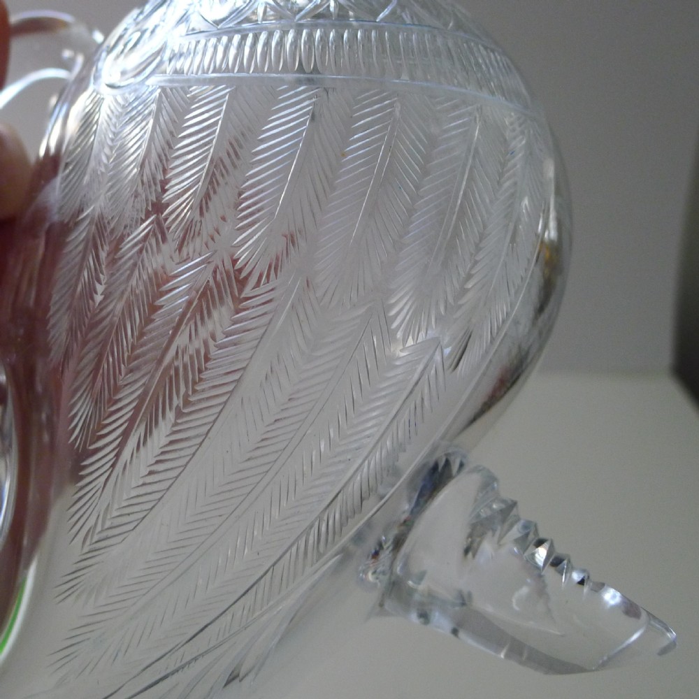 A Victorian cut glass and silver decanter shaped as a duck with a detailed silver head spout and glass body. View II