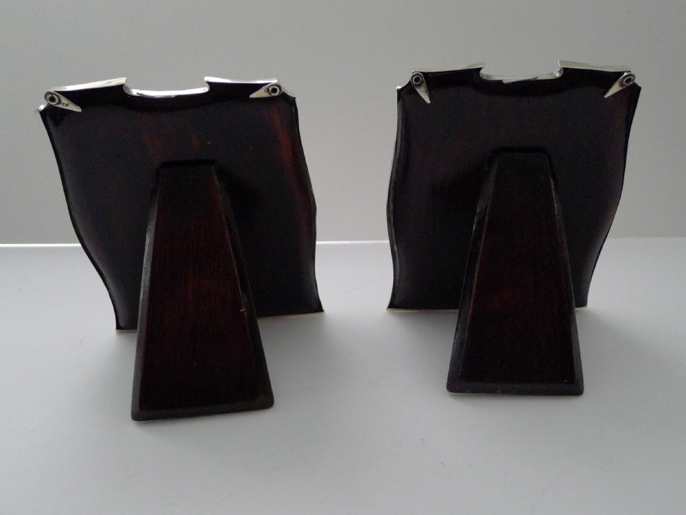 A pair of matching Art Deco silver picture frames with engine-turned geometric engraving and easel backs. View V