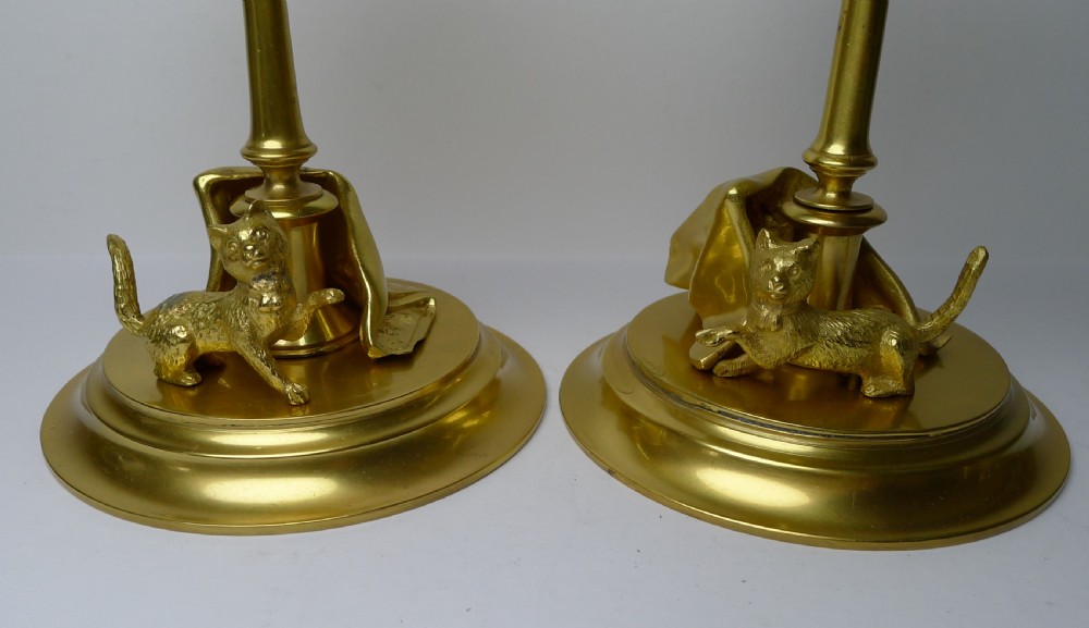 A six-piece gilded bronze desk set decorated with sculpted kitten figures, including two candlesticks, a pen tray, an inkwell, a seal, and a letter opener. View V