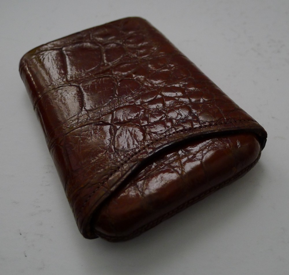 A late Victorian brown crocodile leather pocket cigar case displaying natural scale textures and stitched edges. View IV
