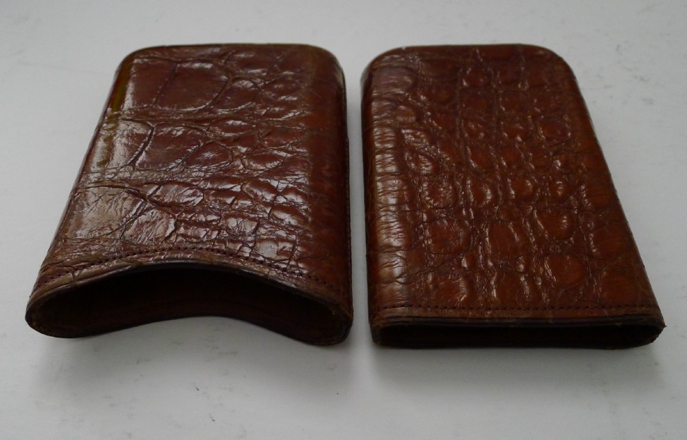A late Victorian brown crocodile leather pocket cigar case displaying natural scale textures and stitched edges. View V