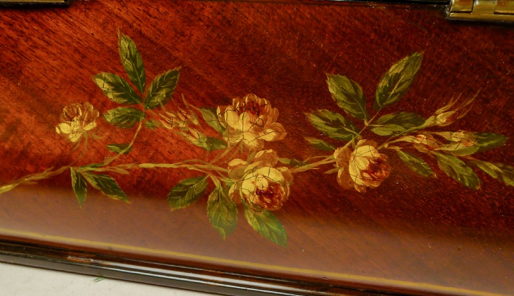 A hand-painted Regency mahogany tea caddy featuring floral decoration, a stepped lid, a brass ring handle, and a keyhole escutcheon. View IV