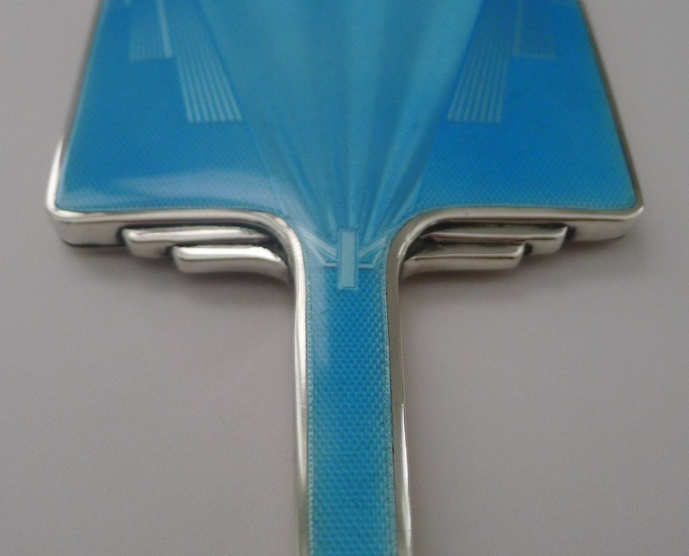 An Art Deco rectangular silver hand mirror featuring a sky-blue guilloche enamel back with geometric engine-turned patterns. View II