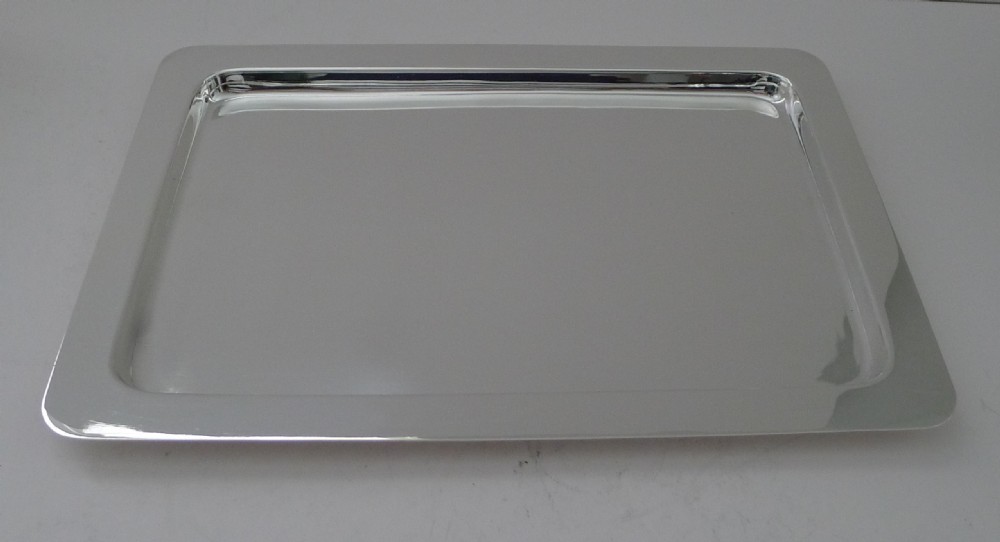 A rectangular polished silver-plated cocktail tray featuring rounded corners and a raised border rim. View IV