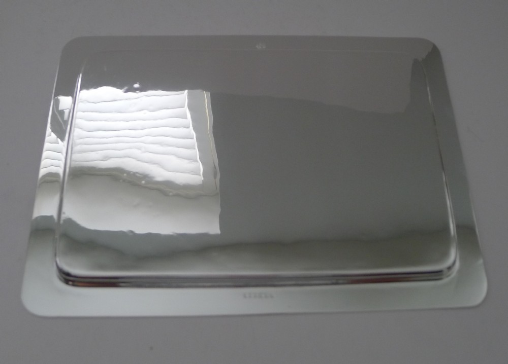A rectangular polished silver-plated cocktail tray featuring rounded corners and a raised border rim. View VI