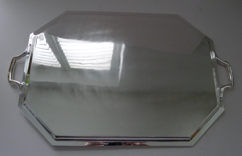 An octagonal Art Deco silver plated drinks tray featuring stepped edge moulding and twin cast handles. View II