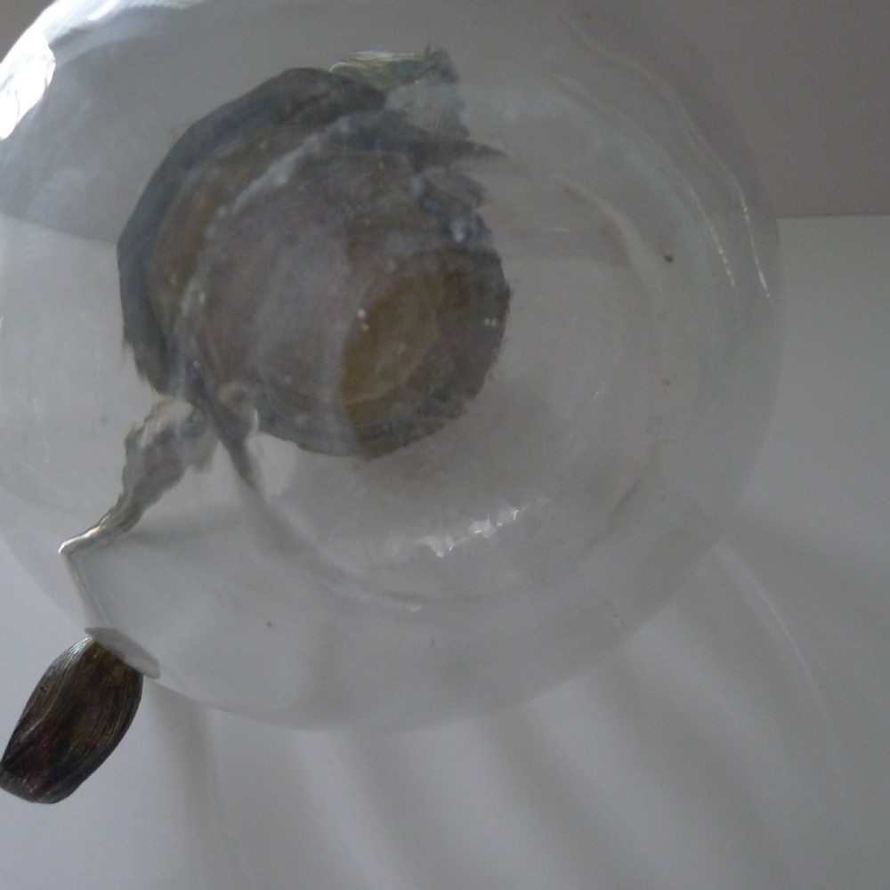 A spherical clear glass jug featuring a detailed cast silver-plated boar head spout and a curved silver handle. View XI