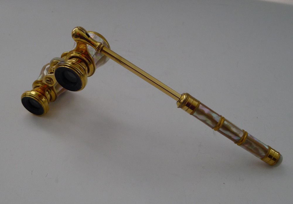 Pair of brass and mother of pearl opera glasses featuring an extendable side handle. View III