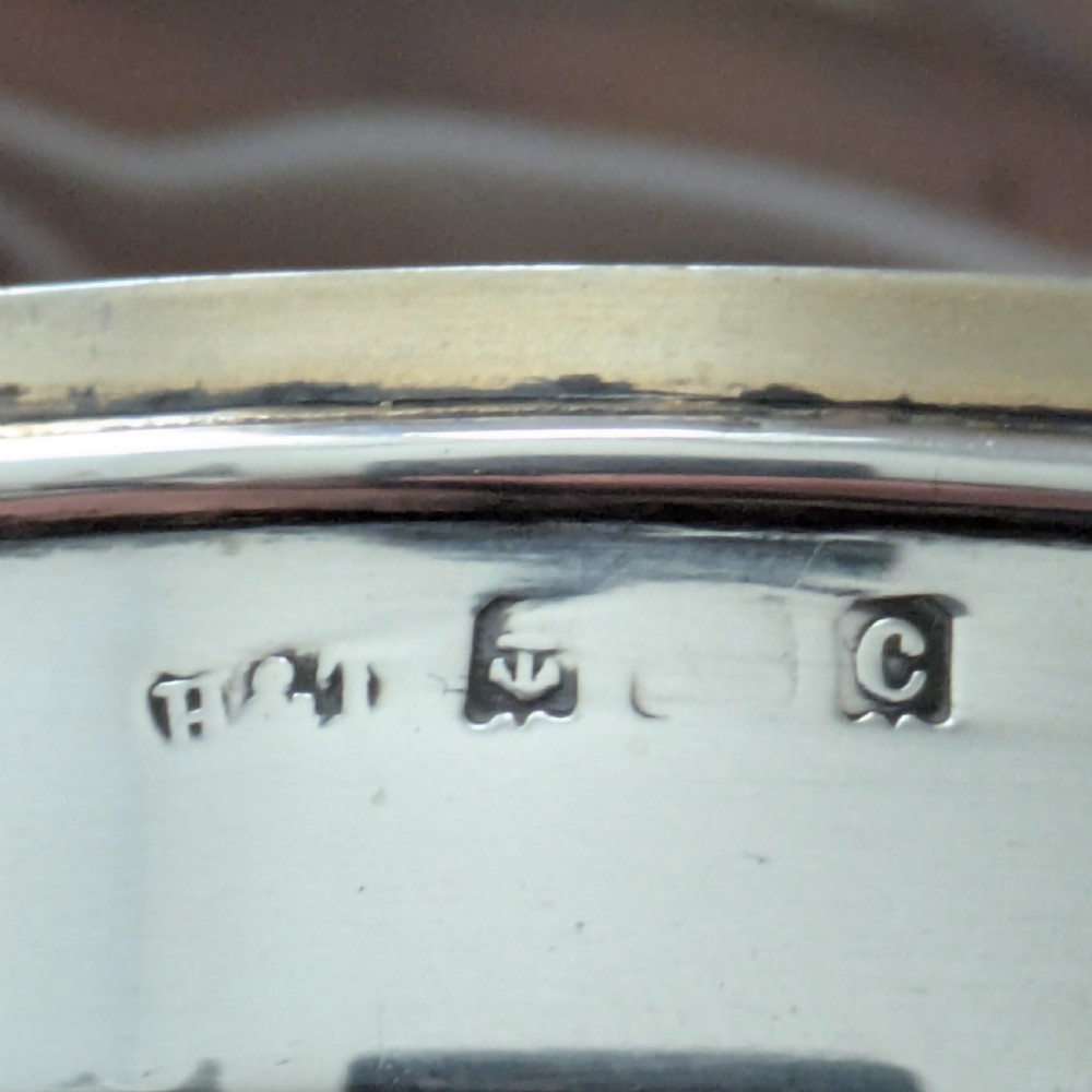 An oval Edwardian sterling silver box featuring polished natural agate stone panels on the hinged top and base. View XIII