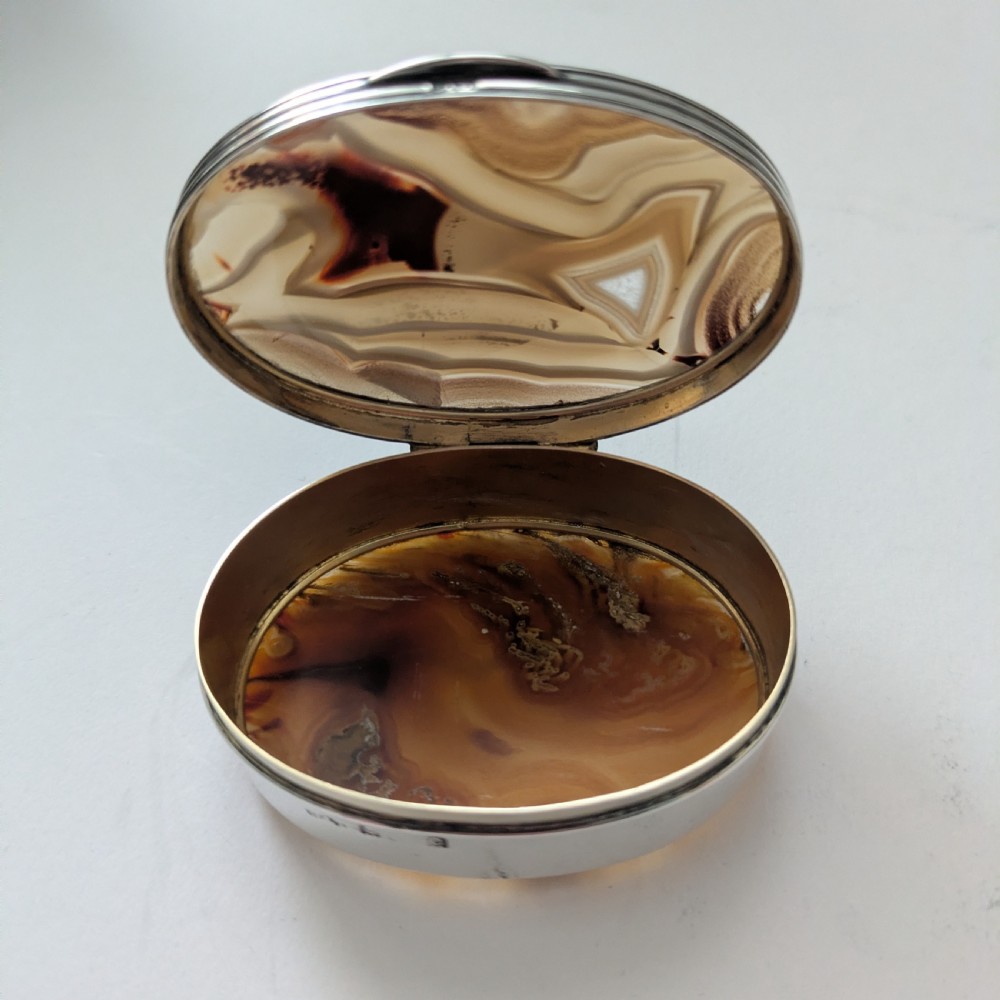 An oval Edwardian sterling silver box featuring polished natural agate stone panels on the hinged top and base. View XIV