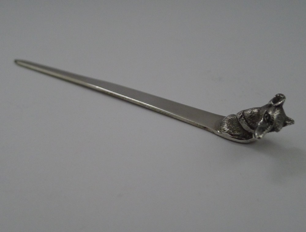 An antique sterling silver letter opener featuring a sculpted greyhound head terminal. View II