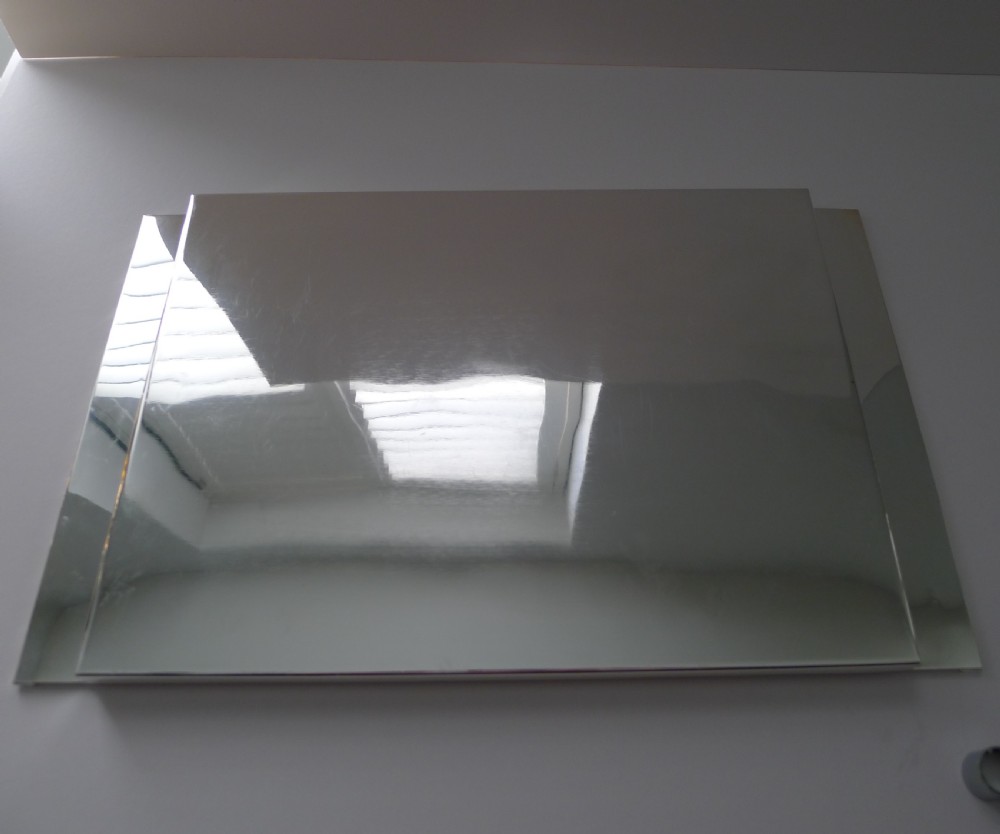 A rectangular polished silver-plated tray featuring cast bamboo-style handles along two opposite ends. View II