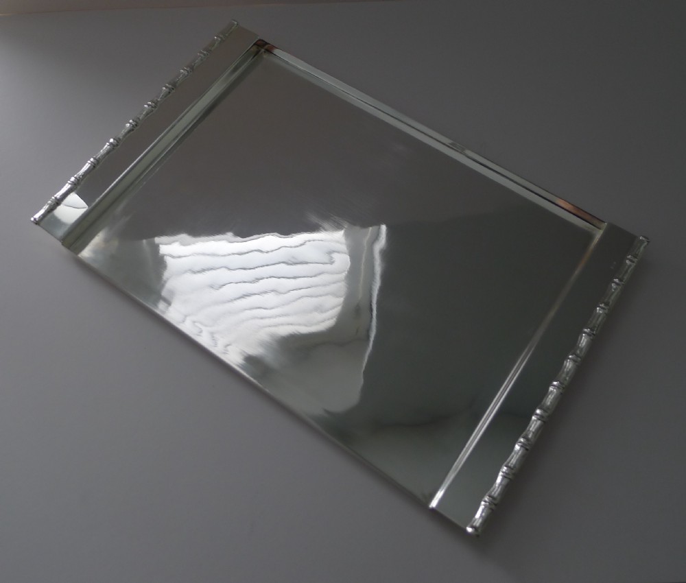A rectangular polished silver-plated tray featuring cast bamboo-style handles along two opposite ends. View III