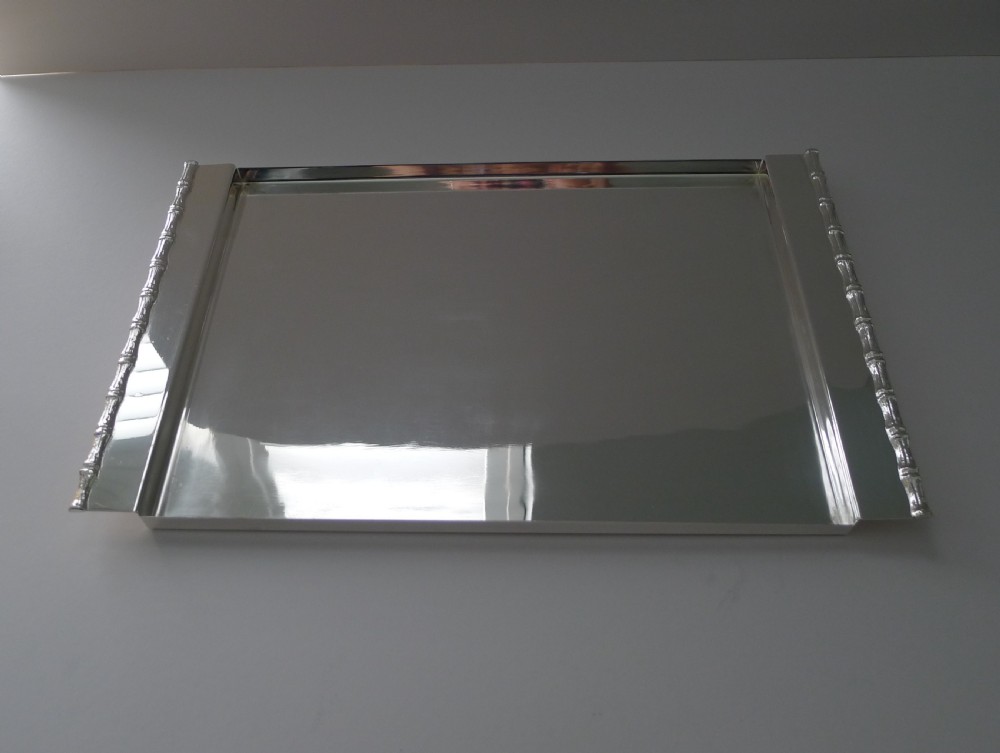 A rectangular polished silver-plated tray featuring cast bamboo-style handles along two opposite ends. View IV