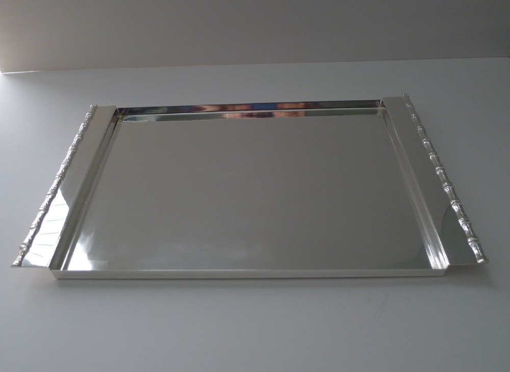 A rectangular polished silver-plated tray featuring cast bamboo-style handles along two opposite ends. View VI
