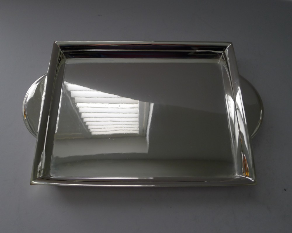 A polished rectangular silver-plated cocktail tray featuring a stepped moulded rim and integrated curved handles. View IV