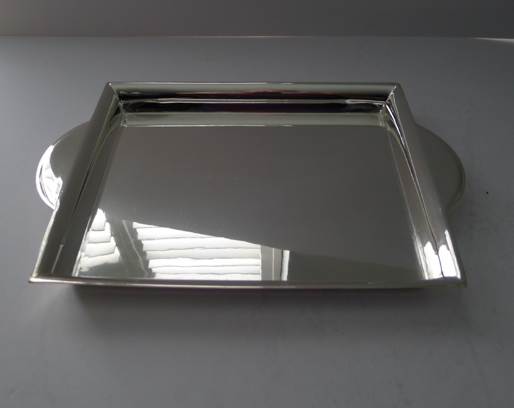 A polished rectangular silver-plated cocktail tray featuring a stepped moulded rim and integrated curved handles. View VI