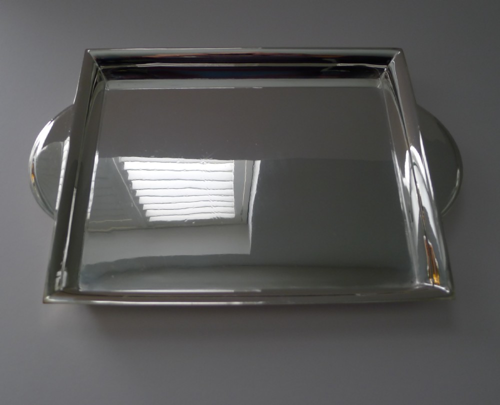 A polished rectangular silver-plated cocktail tray featuring a stepped moulded rim and integrated curved handles. View VII