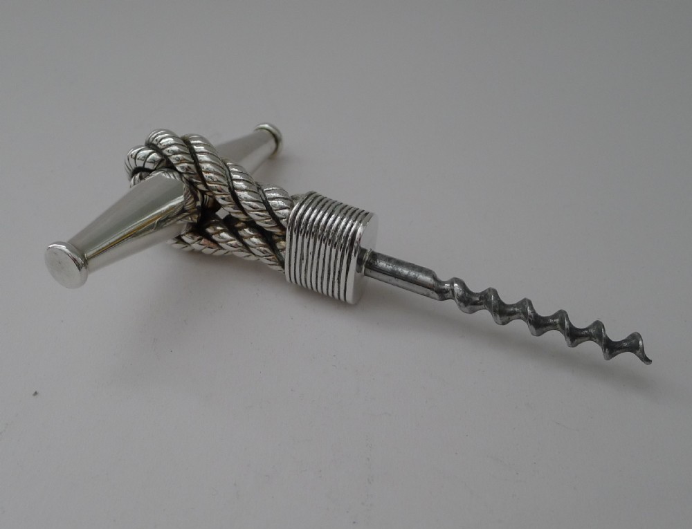 A mid-century silver Hermes T-bar corkscrew featuring a textured rope-twist handle and steel worm. View III