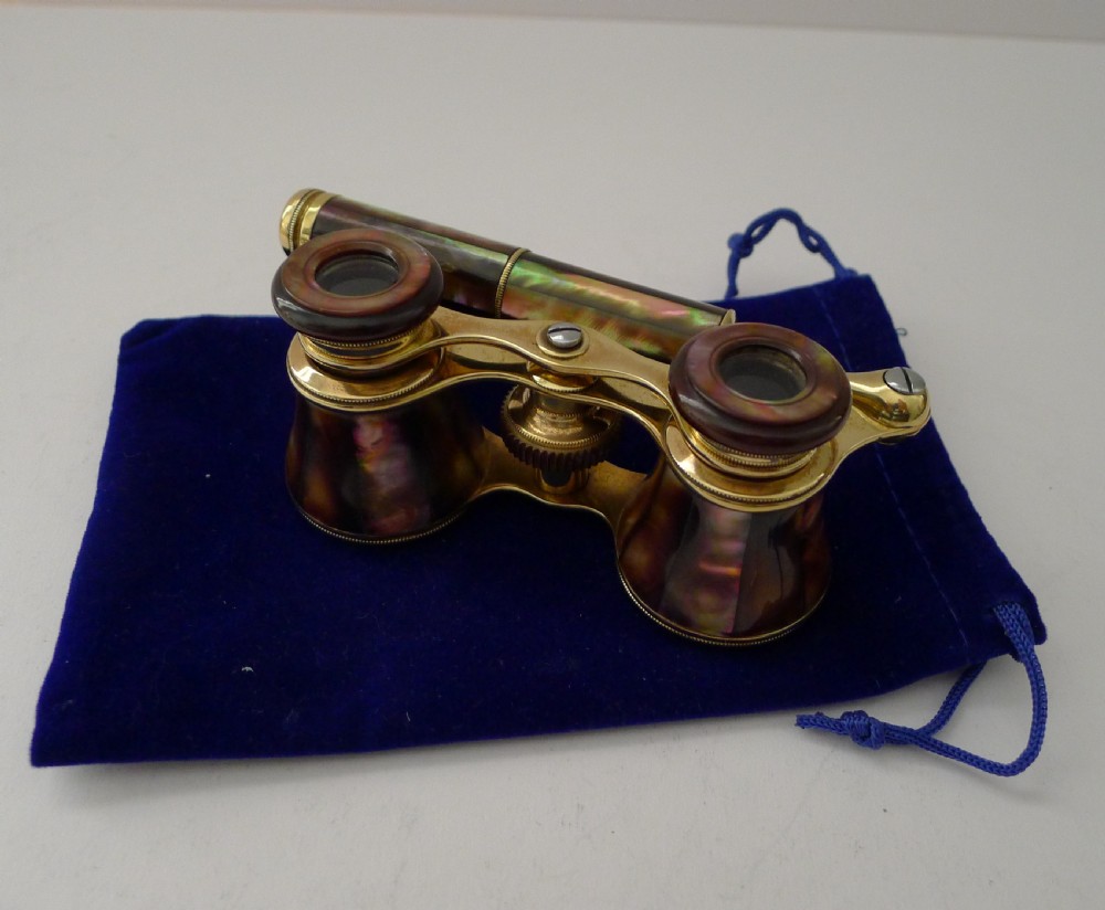 Antique French opera glasses with iridescent abalone shell panels, brass hardware, and a folding lorgnette handle. View XII