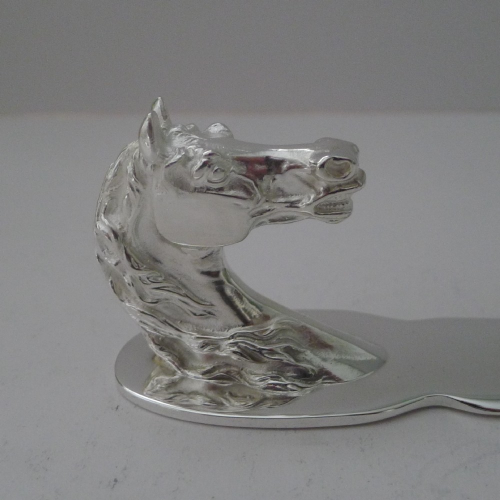 A silvered bronze letter opener featuring a detailed sculpted horse head handle and a polished, tapered blade resting on a neutral background. View III