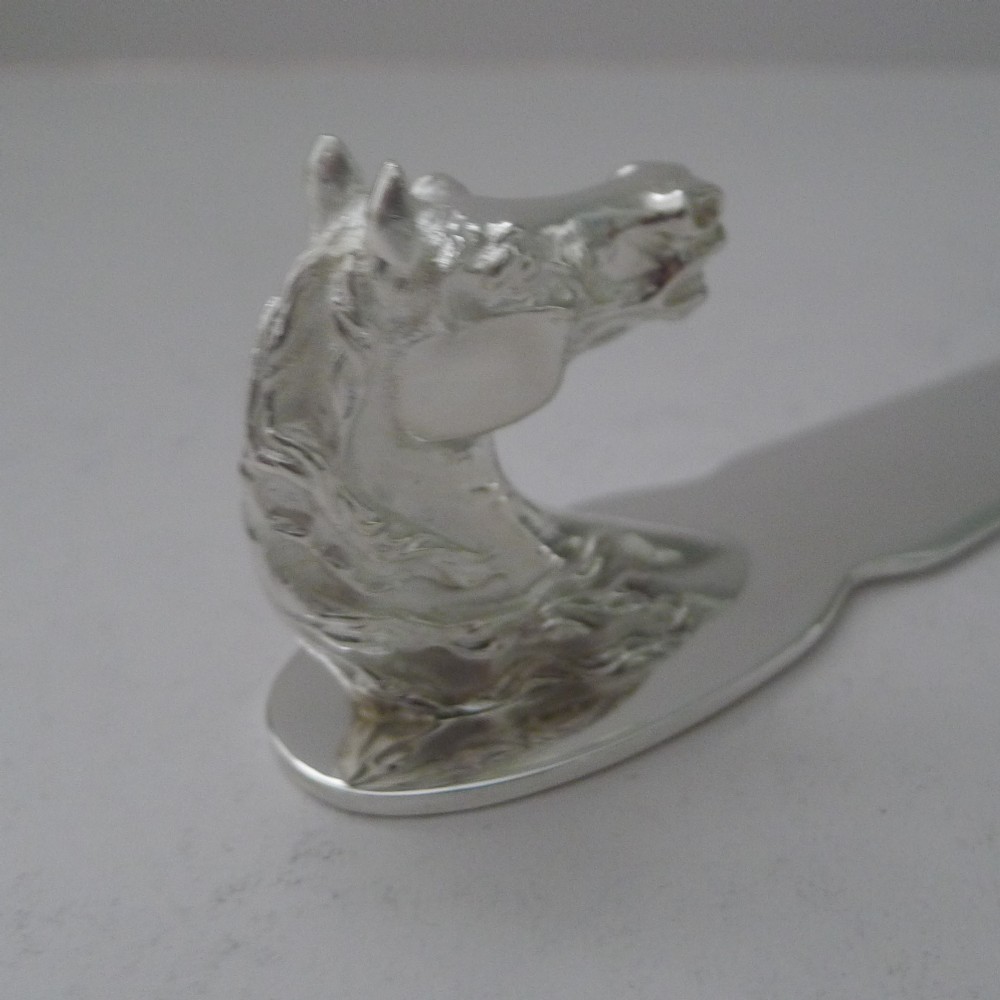 A silvered bronze letter opener featuring a detailed sculpted horse head handle and a polished, tapered blade resting on a neutral background. View IV