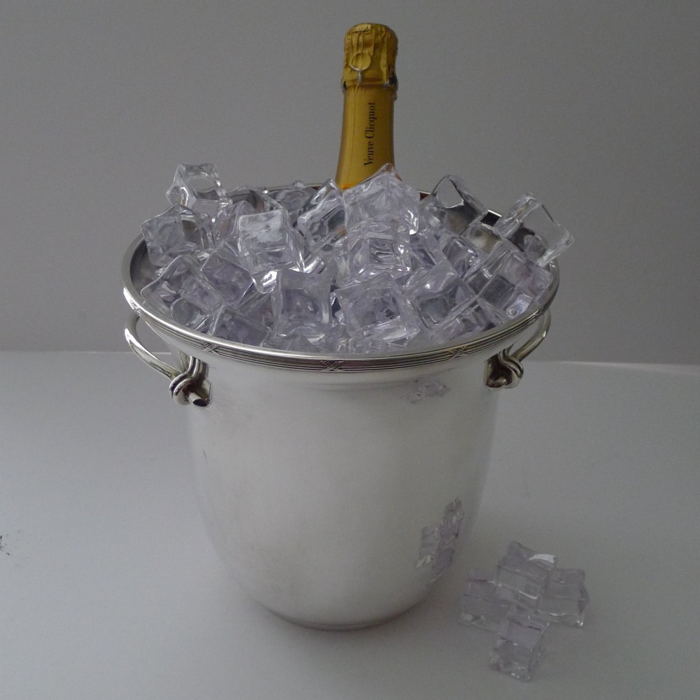 A polished silver-plated French champagne bucket with twin side handles and a detailed reeded rim. View III