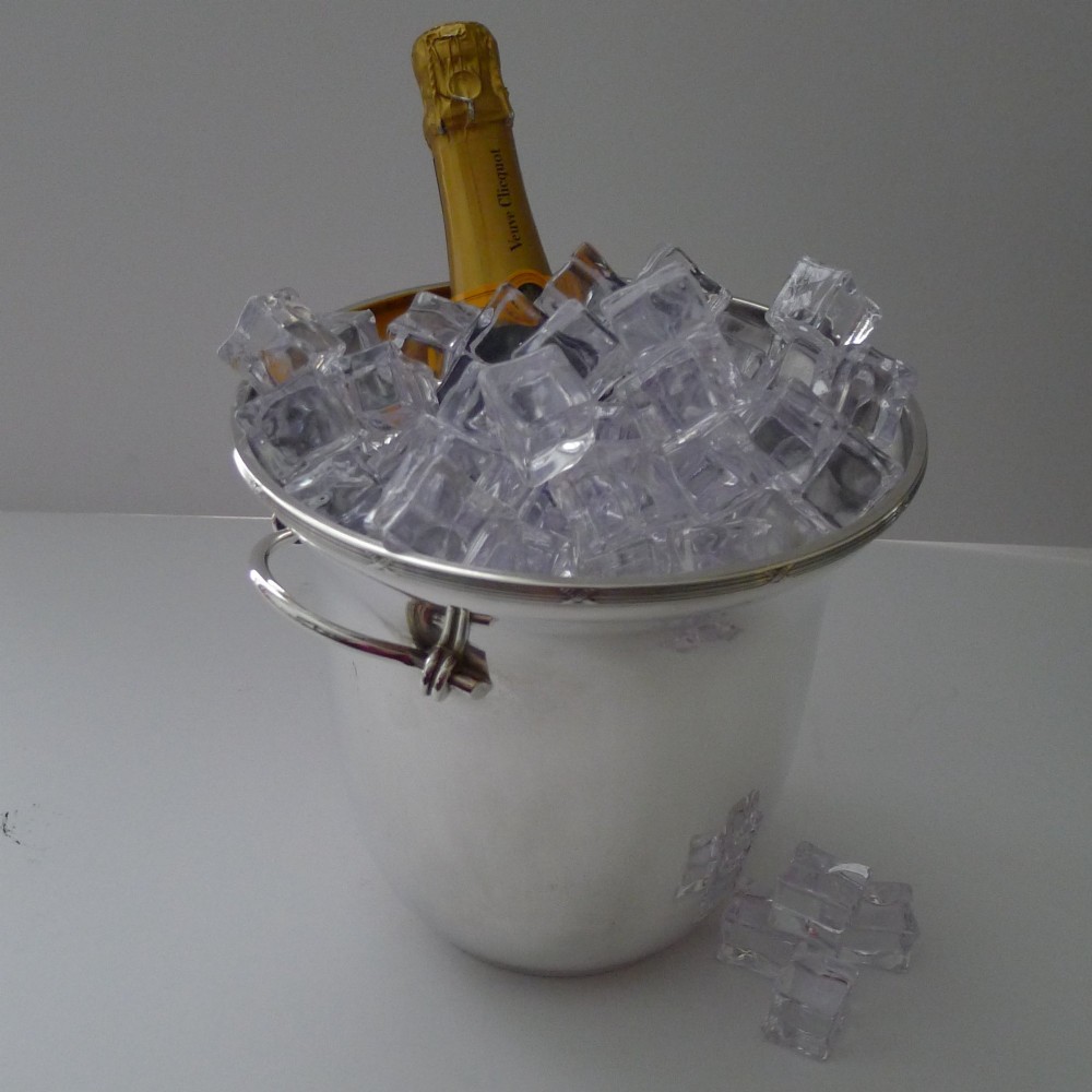 A polished silver-plated French champagne bucket with twin side handles and a detailed reeded rim. View IV